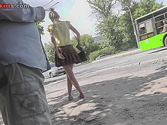Upskirting young girlfriend that is waiting for a bus