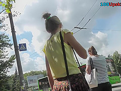 Upskirting young girlfriend that is waiting for a bus
