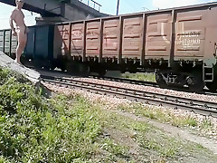 Walking naked by railroad
