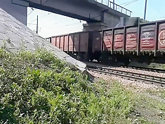Walking naked by railroad