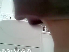 Woman puts skin care lotion over her body