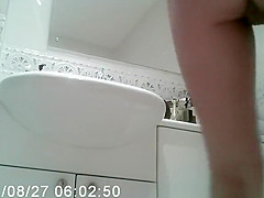 Woman puts skin care lotion over her body